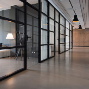 interior of office with glass walls and open doors