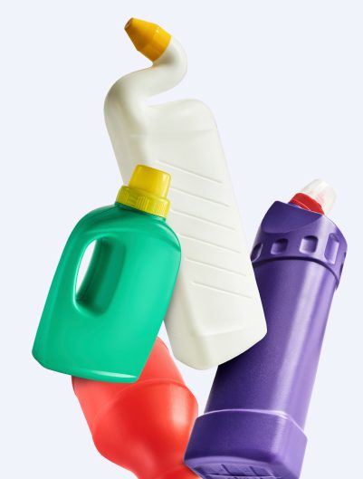 cleaning product bottles of different sizes, tumbling down