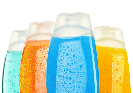 4 clear shampoo bottles with different coloured shampoos